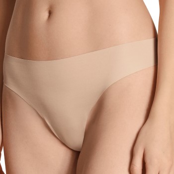 Läs mer om Calida Trosor Natural Skin Thong Beige X-Small Dam